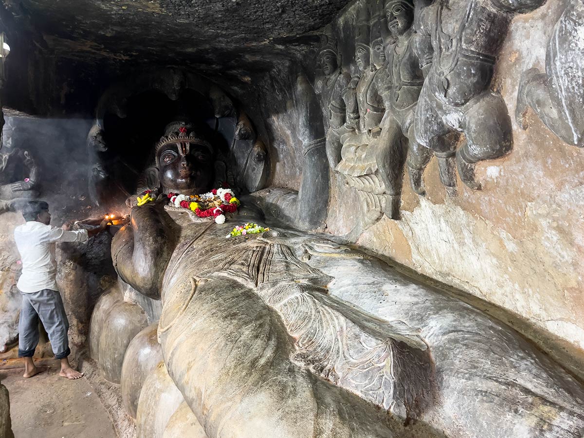 Undavalli Caves, Undavalli (pilgrim doing puja worship at reclining Shiva)
