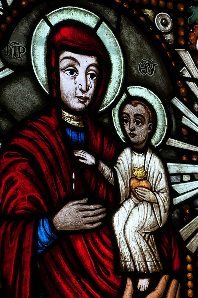 Mariapocs, Basilica of our Lady of Mariapocs, stained glass of Mary holding baby Jesus